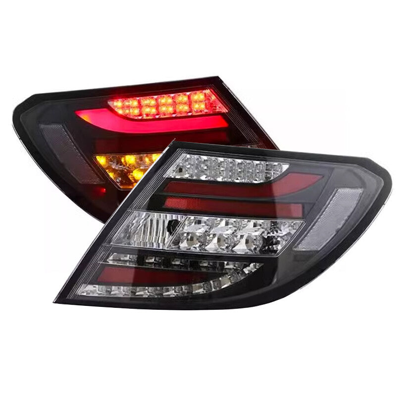 A pair of black LED Perform taillights for Mercedes W204 C-Class 2011-14.